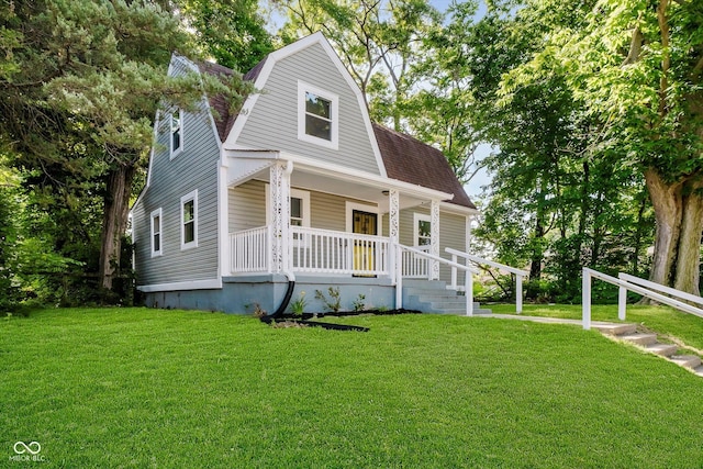 3709 Central Ave, Indianapolis, IN 46205 - dutch colonial with covered porch, a gambrel roof, a front yard, and roof with shingles