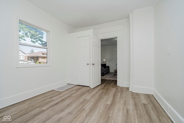 3709 Central Ave, Indianapolis, IN 46205 - unfurnished bedroom with light wood finished floors and baseboards