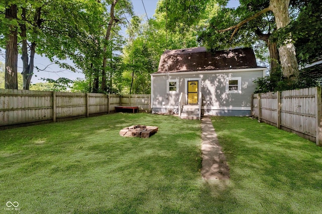 3709 Central Ave, Indianapolis, IN 46205 - fenced backyard with an outdoor fire pit