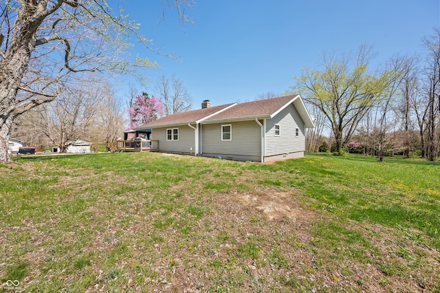 9267 N State Road 135, Morgantown, IN 46160 - rear view of house with a chimney, a wooden deck, and a yard