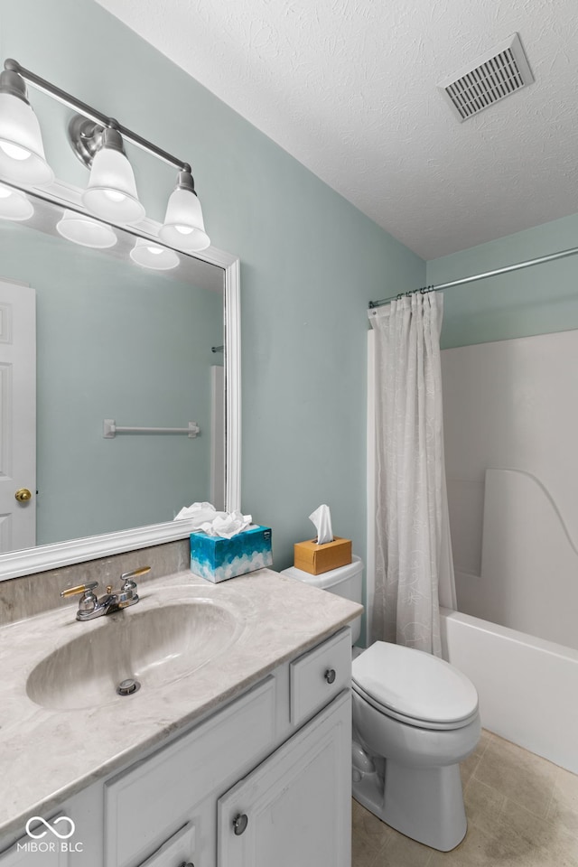 7412 Lattice Dr, Indianapolis, IN 46217 - bathroom with vanity, shower / bath combo, a textured ceiling, and tile patterned floors