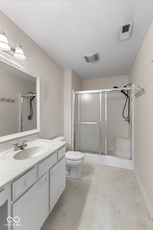7412 Lattice Dr, Indianapolis, IN 46217 - bathroom featuring vanity, a stall shower, and a textured ceiling