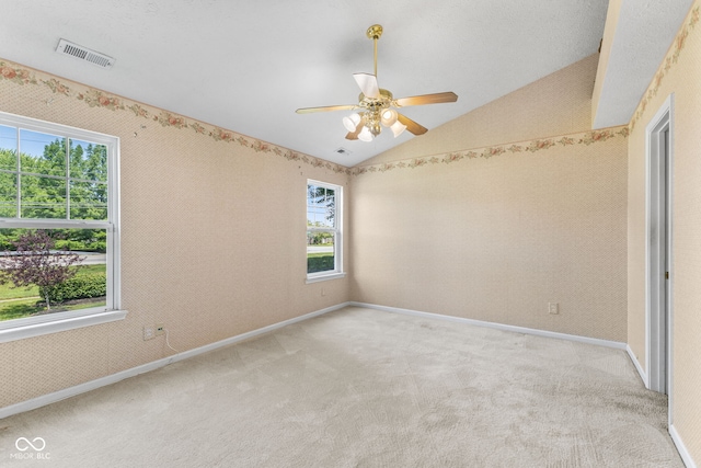 7412 Lattice Dr, Indianapolis, IN 46217 - empty room with vaulted ceiling, light carpet, and ceiling fan