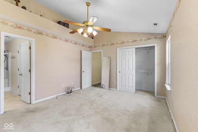 7412 Lattice Dr, Indianapolis, IN 46217 - unfurnished bedroom featuring vaulted ceiling, carpet floors, a closet, and a ceiling fan