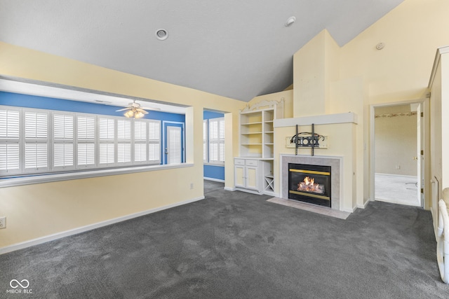 7412 Lattice Dr, Indianapolis, IN 46217 - unfurnished living room featuring a fireplace, dark colored carpet, ceiling fan, and high vaulted ceiling