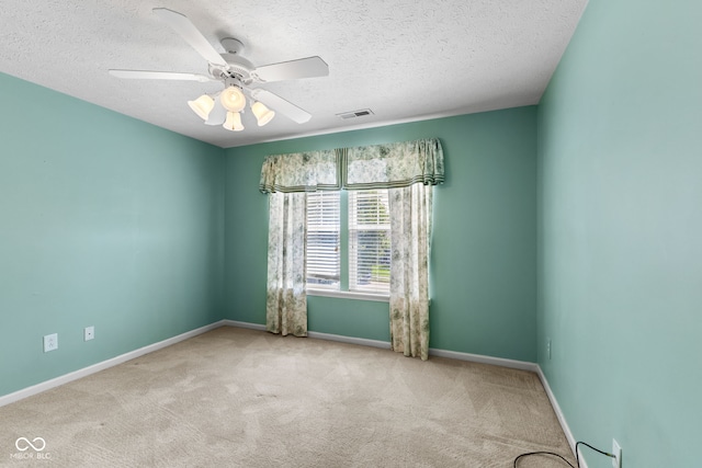 7412 Lattice Dr, Indianapolis, IN 46217 - carpeted empty room with a textured ceiling and ceiling fan