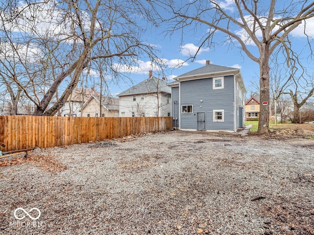 1126 N Rural St, Indianapolis, IN 46201 - back of house with a chimney and a shingled roof