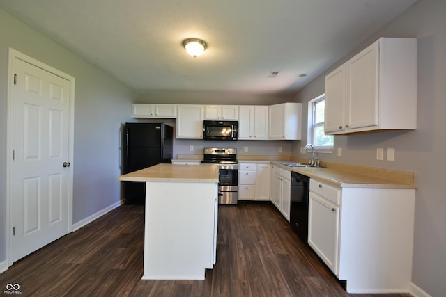 5262 Bogey Dr, Indianapolis, IN 46235 - kitchen with black appliances, dark wood finished floors, light countertops, and white cabinets
