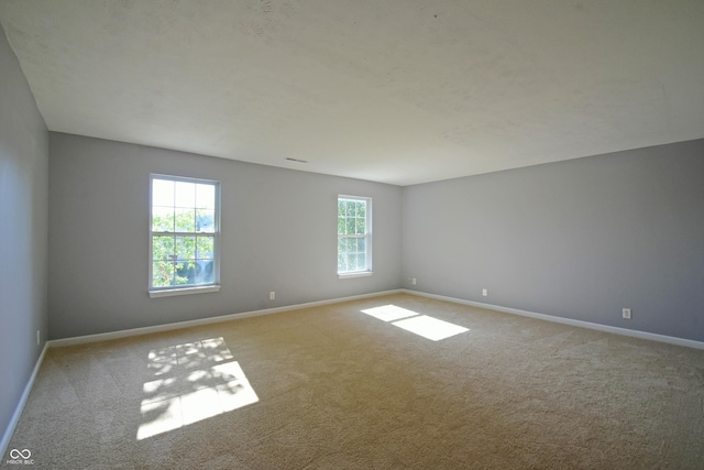 5262 Bogey Dr, Indianapolis, IN 46235 - carpeted spare room with baseboards
