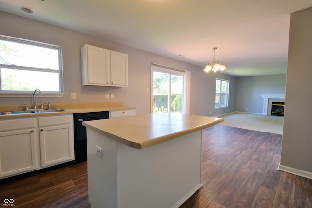 5262 Bogey Dr, Indianapolis, IN 46235 - kitchen featuring dishwasher, a chandelier, white cabinets, a kitchen island, and dark wood finished floors