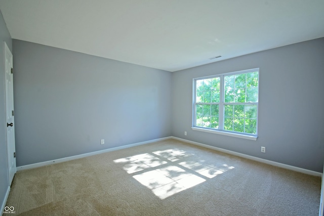 5262 Bogey Dr, Indianapolis, IN 46235 - carpeted empty room with baseboards