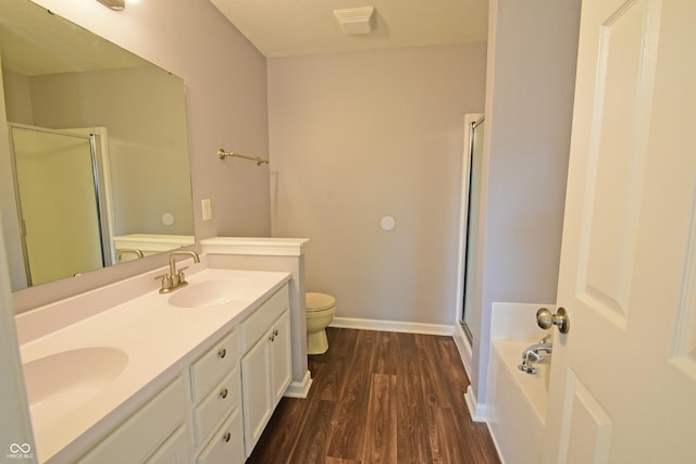 5262 Bogey Dr, Indianapolis, IN 46235 - bathroom featuring a shower stall, double vanity, wood finished floors, and a bath
