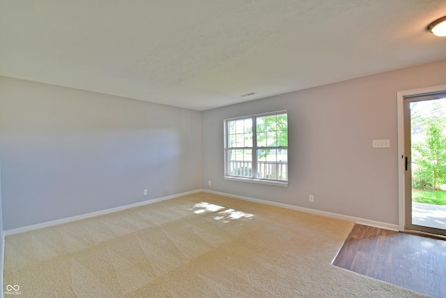5262 Bogey Dr, Indianapolis, IN 46235 - spare room featuring baseboards and carpet floors