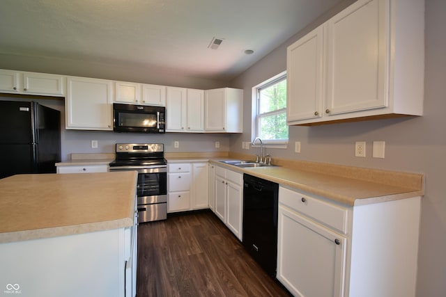 5262 Bogey Dr, Indianapolis, IN 46235 - kitchen with black appliances, dark wood-type flooring, and white cabinetry