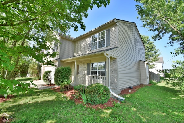 5262 Bogey Dr, Indianapolis, IN 46235 - view of front of home with covered porch, a front lawn, and brick siding