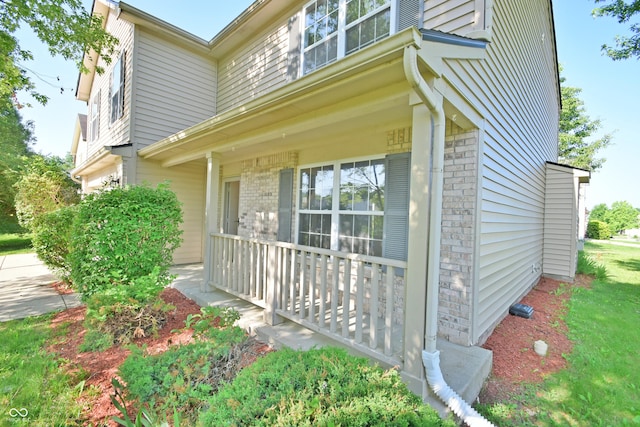 5262 Bogey Dr, Indianapolis, IN 46235 - view of side of home with brick siding and covered porch