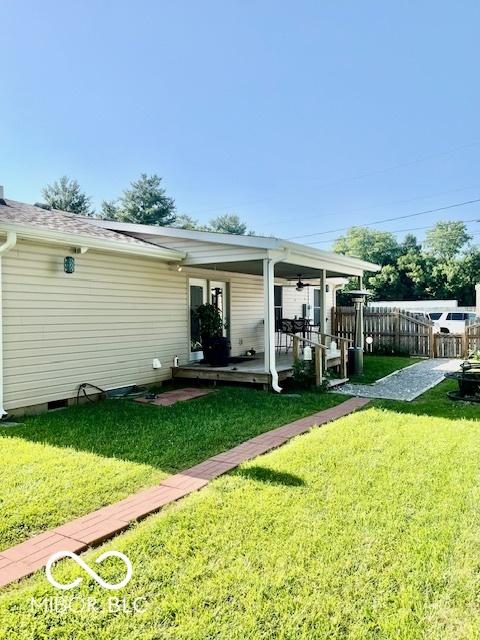 409 N Kyle St, Edinburgh, IN 46124 - rear view of property featuring crawl space, ceiling fan, and a patio