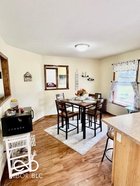 409 N Kyle St, Edinburgh, IN 46124 - dining area featuring light wood-style flooring and baseboards