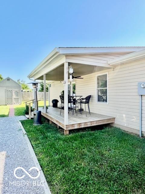 409 N Kyle St, Edinburgh, IN 46124 - deck featuring outdoor dining space and an outbuilding