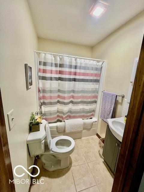 409 N Kyle St, Edinburgh, IN 46124 - full bathroom featuring shower / bath combo, vanity, and tile patterned flooring