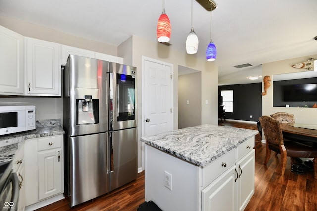 10539 Ross Xing, Fishers, IN 46038 - kitchen featuring stainless steel fridge with ice dispenser, white microwave, dark wood-style flooring, and white cabinetry