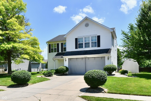 10539 Ross Xing, Fishers, IN 46038 - traditional-style home featuring concrete driveway, a garage, a front yard, and roof with shingles