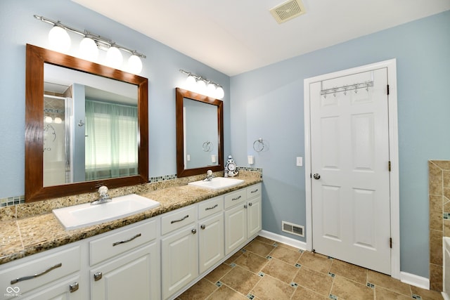 10539 Ross Xing, Fishers, IN 46038 - bathroom with double vanity, a shower, and tile patterned floors