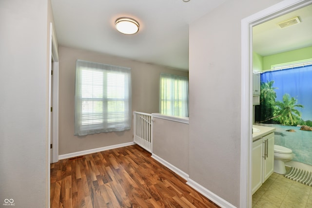 10539 Ross Xing, Fishers, IN 46038 - hall featuring wood finished floors and baseboards