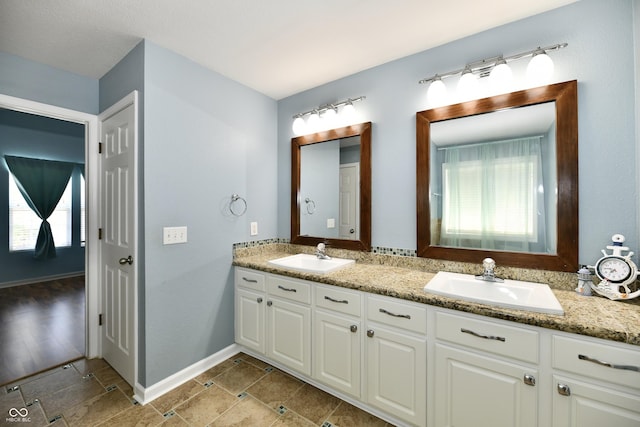 10539 Ross Xing, Fishers, IN 46038 - full bathroom featuring double vanity and baseboards