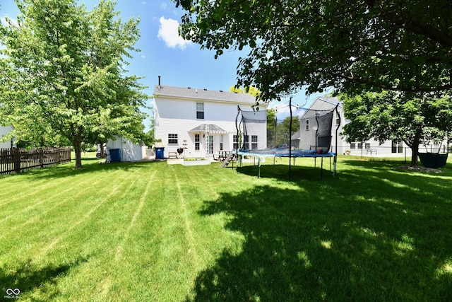 10539 Ross Xing, Fishers, IN 46038 - rear view of house with a trampoline and a shed