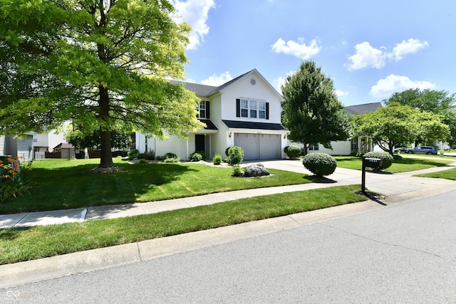 10539 Ross Xing, Fishers, IN 46038 - view of front of property featuring an attached garage, concrete driveway, and a front yard