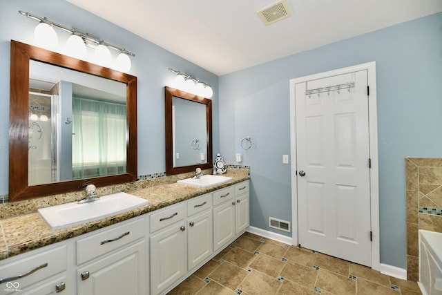 10539 Ross Xing, Fishers, IN 46038 - full bathroom featuring double vanity, a tub to relax in, and a shower with door