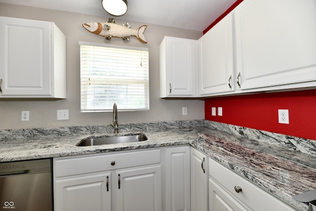 10539 Ross Xing, Fishers, IN 46038 - kitchen with stainless steel dishwasher, white cabinetry, and light stone counters