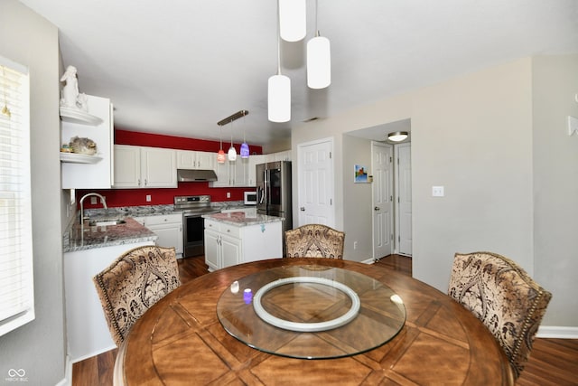 10539 Ross Xing, Fishers, IN 46038 - dining space featuring dark wood-style flooring and baseboards