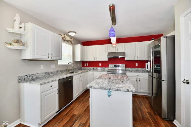 10539 Ross Xing, Fishers, IN 46038 - kitchen with stainless steel appliances, under cabinet range hood, white cabinetry, a kitchen island, and open shelves