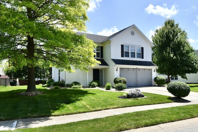 10539 Ross Xing, Fishers, IN 46038 - view of front of house featuring a garage, driveway, a front lawn, and roof with shingles