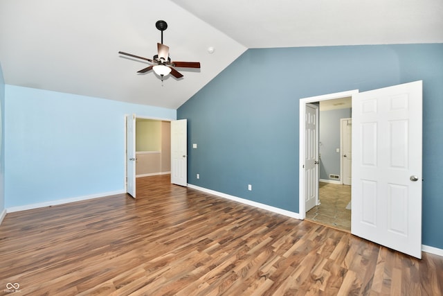 10539 Ross Xing, Fishers, IN 46038 - unfurnished bedroom with wood finished floors, a ceiling fan, and high vaulted ceiling