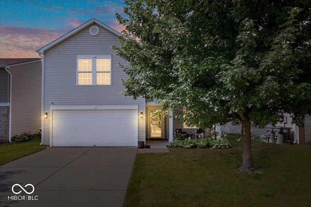 9497 W Stargazer Dr, Pendleton, IN 46064 - view of front of home with concrete driveway, an attached garage, and a yard