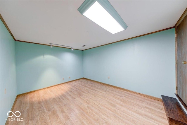 11 N Restin Rd, Greenwood, IN 46142 - empty room with track lighting, wood finished floors, and crown molding