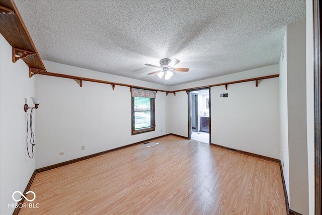 11 N Restin Rd, Greenwood, IN 46142 - spare room with ceiling fan, light wood-type flooring, and a textured ceiling