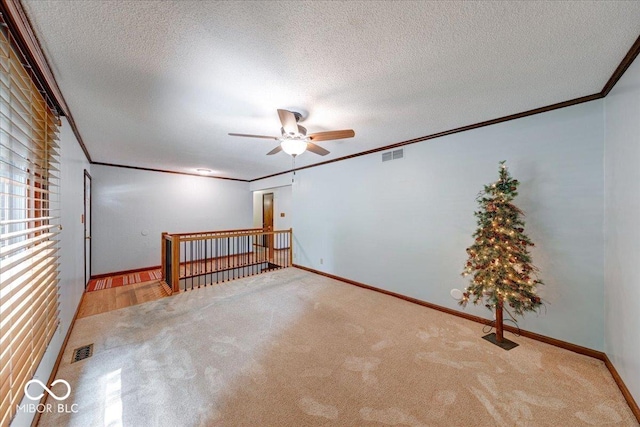 11 N Restin Rd, Greenwood, IN 46142 - carpeted spare room featuring ornamental molding, ceiling fan, and a textured ceiling