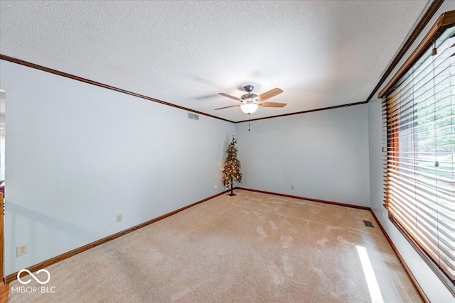 11 N Restin Rd, Greenwood, IN 46142 - spare room featuring ceiling fan, ornamental molding, a textured ceiling, and light colored carpet