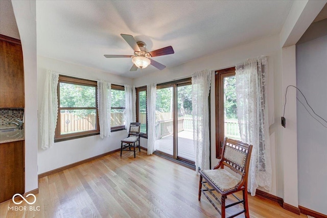 11 N Restin Rd, Greenwood, IN 46142 - living area featuring a ceiling fan and light wood-style floors