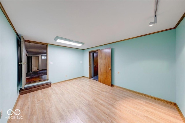 11 N Restin Rd, Greenwood, IN 46142 - unfurnished living room featuring wood finished floors and crown molding