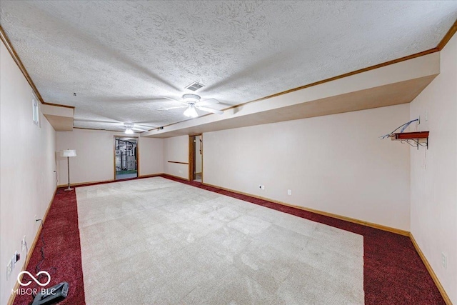 11 N Restin Rd, Greenwood, IN 46142 - finished basement featuring carpet, crown molding, and a textured ceiling