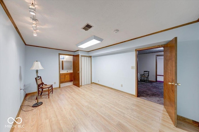 11 N Restin Rd, Greenwood, IN 46142 - unfurnished room with ornamental molding, light wood-style flooring, and a textured ceiling