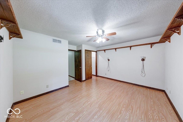 11 N Restin Rd, Greenwood, IN 46142 - spare room with ceiling fan, light wood-style flooring, and a textured ceiling