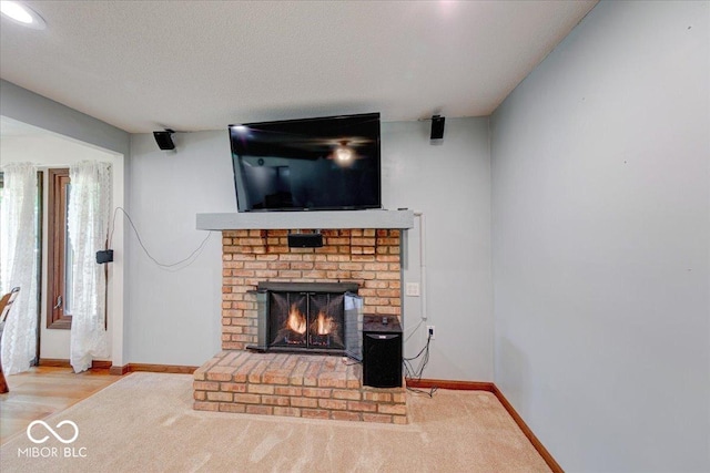 11 N Restin Rd, Greenwood, IN 46142 - unfurnished living room with a fireplace, carpet flooring, and a textured ceiling