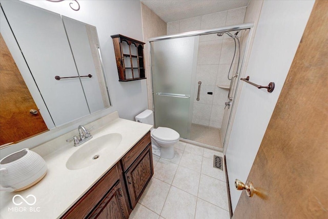 11 N Restin Rd, Greenwood, IN 46142 - bathroom with a shower stall, vanity, and tile patterned flooring