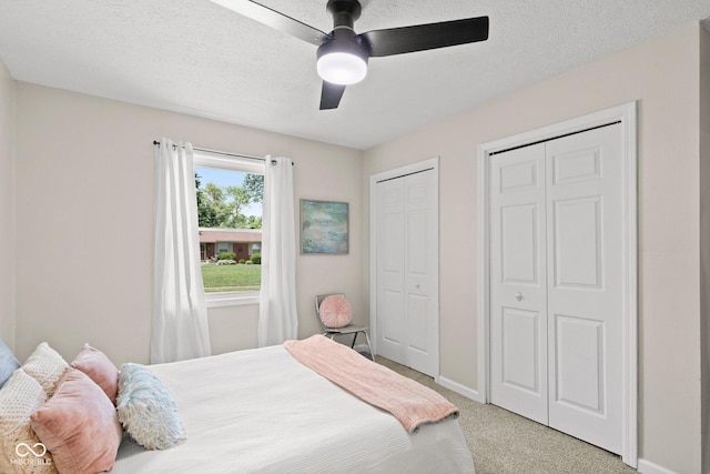 121 Hooton Blvd, Madison, IN 47250 - bedroom featuring multiple closets, light colored carpet, and a ceiling fan